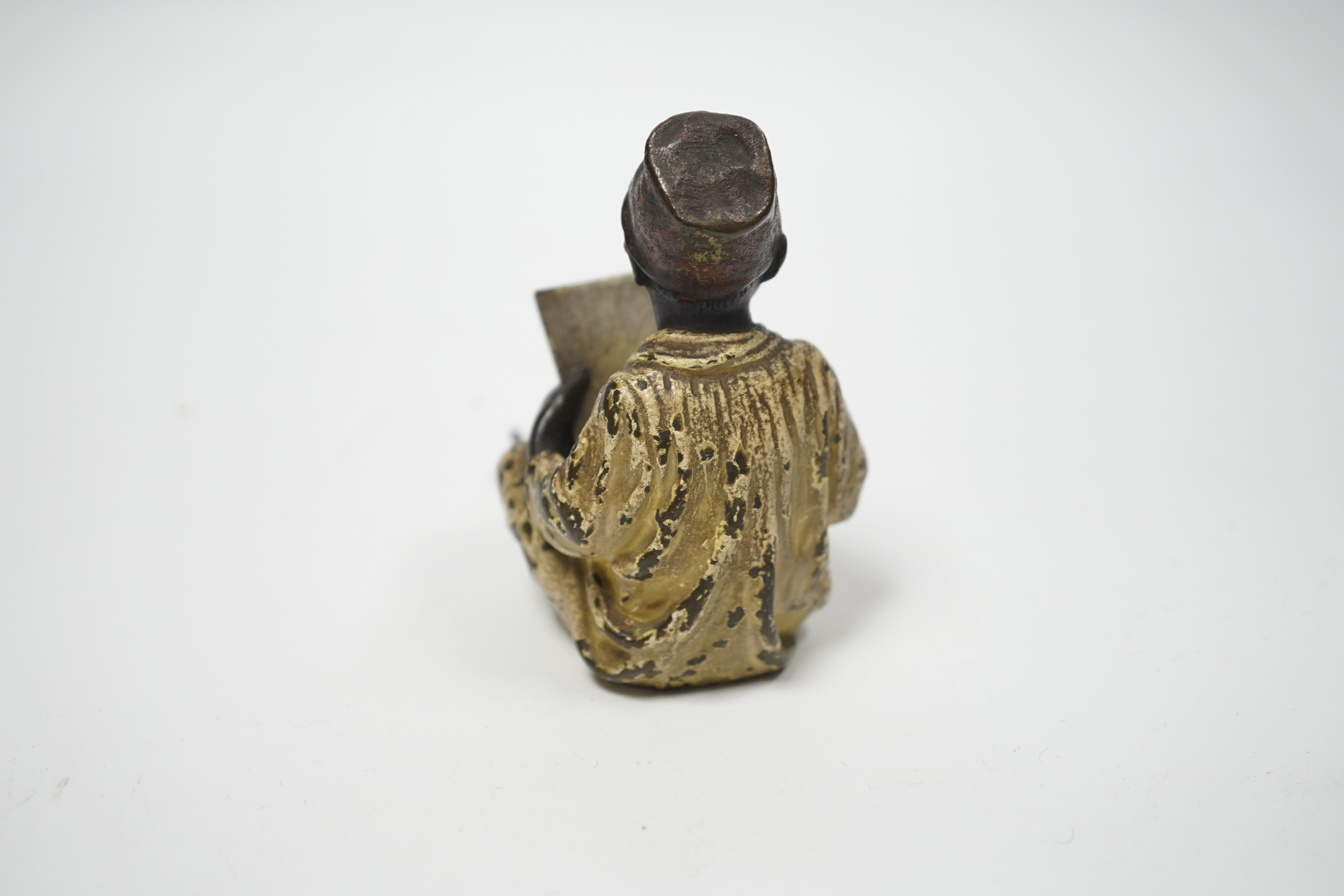 A Viennese cold painted bronze of a boy with book, 8.5cm high